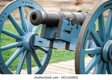 A Revolutionary War Cannon Close Up With A Blurry Background.