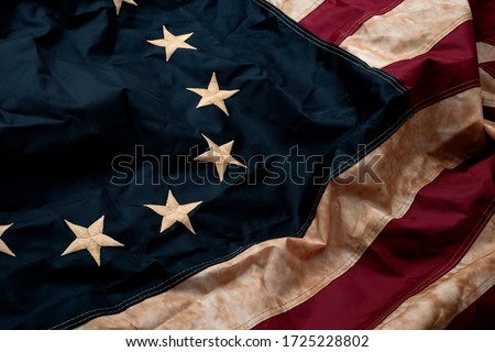 Revolutionary war, patriotism and birth of the United Sates of America concept with closeup on the original 13 star American flag known as the Betsy Ross