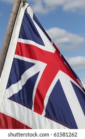 Revolutionary War Period Flag Against A Bright Blue Sky