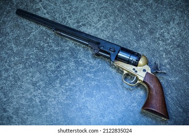 Revolver 44 caliber on black powder, close-up photo.