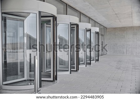 Revolving doors. The facade of a modern shopping center or station, an airport with revolving doors.
