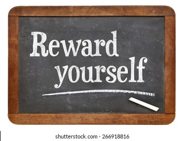 Reward Yourself - Motivational Words On A Vintage Slate Blackboard