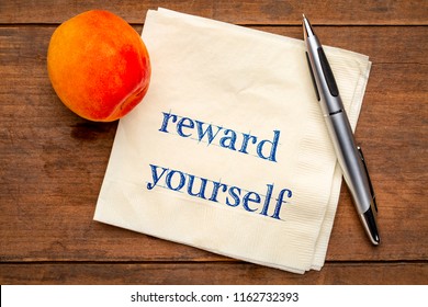 Reward Yourself Reminder - Handwriting On A Napkin With A Fresh Apricot