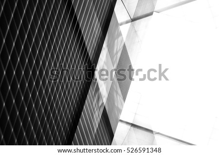 Reworked modern architecture photo featuring spacious empty area for text placement. Abstract business interior in minimalism or hi-tech design. Tilt black-and-white photo with checkered wall panels.