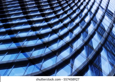 Reworked photo of curvilinear hi-tech office building fragment reflecting blue sky. Modern architectural detail. Glazed aluminum structure. Abstract contemporary architecture image. - Powered by Shutterstock