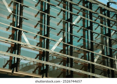 Reworked photo of glass facade wall. Abstract modern architecture fragment with geometric pattern of rectangles. Structural glazing of hi-tech building. Commercial exterior with metal framework. - Powered by Shutterstock