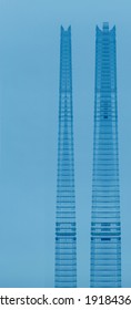 Reworked photo of a glass skyscraper split into twin towers. Abstract modern architecture. Hi-tech skyline of business city or financial downtown. Tall buildings in concept of similar but different. 
