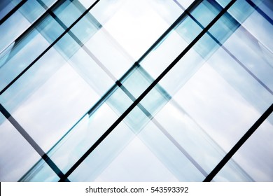 Reworked Tilt Photo Of Glass Walls Of Office Building. Abstract Modern Architecture Background With Geometric Structure.