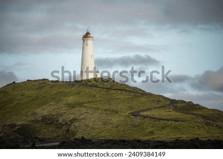 Reykjanes Lighthouse in Iceland with on the hill of peninsula. Landscape scenery