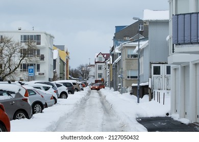 Reykjavik Iceland February 21 2022 Snow Storm And Windy Weather In Winter In Downtown City Streets Covered In Snow, Cars Vehicles Covered And Stuck In Snow On The Road