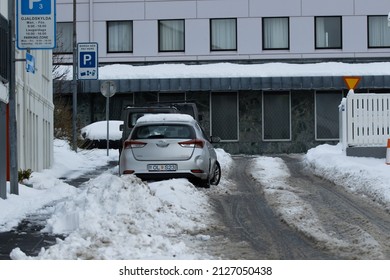 Reykjavik Iceland February 21 2022 Snow Storm And Windy Weather In Winter In Downtown City Streets Covered In Snow, Cars Vehicles Covered And Stuck In Snow On The Road