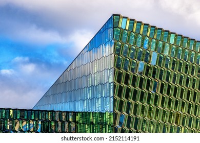 Reykjavik, Iceland - October 2022: The Harpa Concert Hall And Conference Centre In Reykjavik Old Harbour. Detail Of The Exterior Glass And Steel Facade With Blue Sky Background.