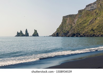 Reynisdrangar Cliffs and sea stacks in Vik, Iceland - Powered by Shutterstock