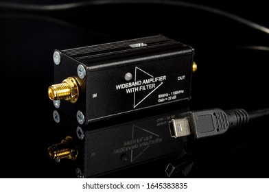 RF And Microwave Wideband Signal Amplifier Isolated On The Black Reflective Surface