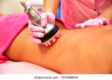 Rf skin tightening, belly. Hardware cosmetology. Body care. Non surgical body sculpting. Ultrasound cavitation body contouring treatment, anti-cellulite and anti-fat therapy in beauty salon.  - Shutterstock ID 1919688944