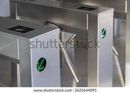 RFID card access control system on modern stainless steel turnstile gate in smart office building, contactless security entrance, workplace access, biometric ID, secure entry technology