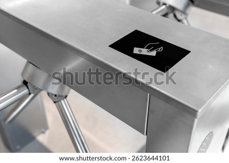 RFID card access control system on modern stainless steel turnstile gate in smart office building, contactless security entrance, workplace access, biometric ID, secure entry technology