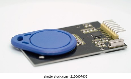 RFID Key Keychain Blue Electronic Component. Electronic Proximity Key For Intercom. Access For Staff At White Isolated. Copy Clone Digital Card For Entrance Lock. Security.