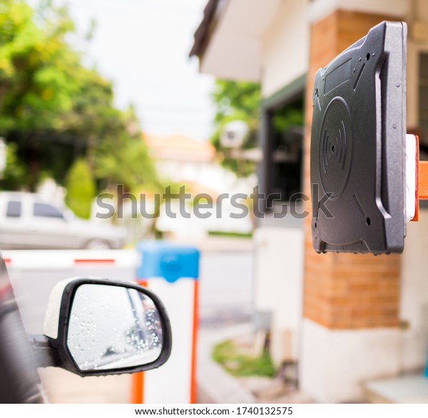 RFID reader of car access\
control to open the door for safety system. Card reader station for\
open the car park door. Security system for parking. The security\
concept.