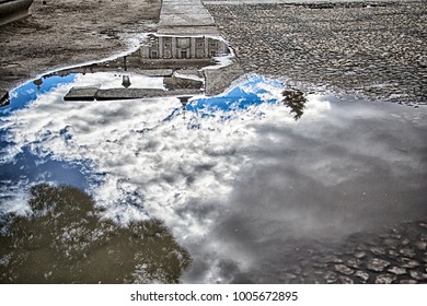 a rflected image in a puddle of water