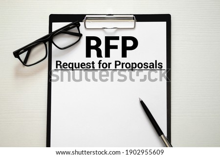 RFP- Request For Proposal written in notebook.