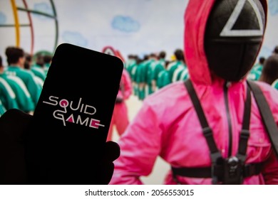 Rheinbach, Germany  12 Ocotber 2021,  
The logo of the new Netflix series "Squid Game" on the display of a smartphone in front of the TV