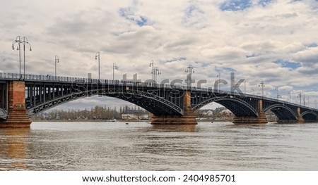 Rhine bridge in Mainz on a gloomy winter's day at high tide.