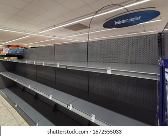 Rhineland-Palatinate /Germany - March, 14,2020: Empty Shelf For Toilet Paper In A Supermarket. Because Of Corvid-19 People Buy In Large Quantities.