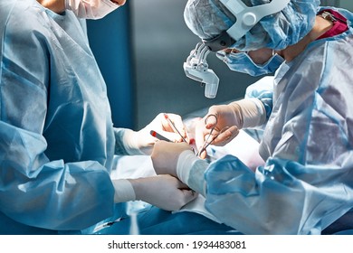 Rhinoplasty men, the surgeons gloved hands hold the instruments during nose surgery Doctor in gloves holds medical instrument during rhinoplasty