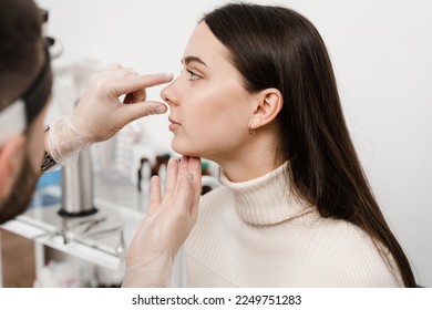 Rhinoplasty is reshaping nose surgery for change appearance of the nose and improve breathing. Consultation with ENT before rhinoplasty plastic surgery to change nose shape and improve breathing - Shutterstock ID 2249751283