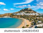 Rhodes, Greece. Lindos small whitewashed village and the Acropolis, scenery of Rhodos Island at Aegean Sea.