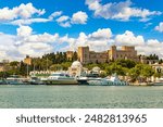 Rhodes Greece Two deer at Mandraki harbor, Rhodes old town with view at Holy Metropolis of Rhodes church