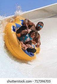 Rhodes, Greece-September 2,2017:Family Drive With Tube On The Rafting Slide In The  Water Park.Rafting Slide Is One Of Many Popular Game For Adults And Children In Park.
