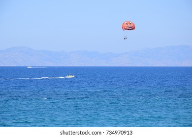 Rhodes Town, Greece
September 2017
People Parasailing Near A Beach In Rhodes Town