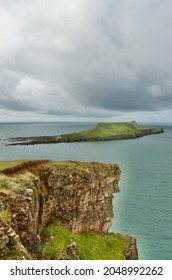 Rhossili Bay, Gower, Wales - August 19, 2021: A view of Worm's Head from Rhossili headland  