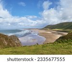 Rhossili Bay lies at the western end of the beautiful Gower peninsula. 3 miles of golden sands, iconic landscapes including Rhossili Downs and Llangennith Beach.