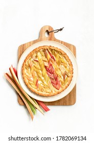 Rhubab Open Faced Round Pie Served On A Wooden Cutting Board, Overhead View, Seasonal Culinary Concept 