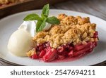 Rhubarb Crumble: Baked dessert with a tart rhubarb filling and a crumbly topping, often served with custard or cream.