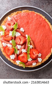 Rhubarb Strawberry Tart With Mousse Close-up On The Table. Vertical Top View From Above
