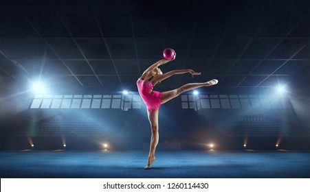 Rhythmic gymnast in professional arena. - Powered by Shutterstock