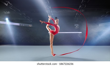 Rhythmic gymnast in professional arena. - Powered by Shutterstock