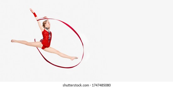 Rhythmic gymnastics banner. Pretty girl in leotard with ribbon leaping in air on white background, panorama