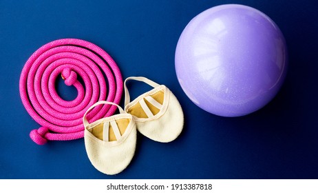 Rhythmic Gymnastics Equipment On A Blue Background