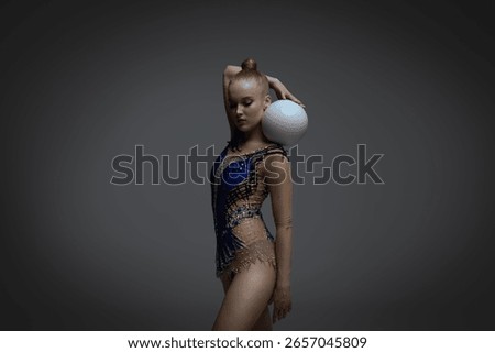 Rhythmic gymnastics in studio soft light.
