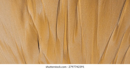 Rhythmic sand ripples create a hypnotic geometric pattern. Parallel lines and soft shadows enhance the tactile organic texture of this minimalist desert landscape view.