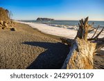 Rialto Beach with driftwood and pebbly sand in Washington State. Rialto Beach, situated within Olympic National Park, is positioned to the north of La Push, the Quileute Tribe