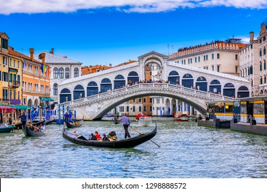 Rialto bridge and Grand Canal in Venice, Italy. View of Venice Grand Canal with gandola. Architecture and landmarks of Venice. Venice postcard