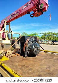 
Riau, Indonesia : Oct 2021 The Screw Type Air Compressor Unit Is On A Mobile Crane For Repairs At The Shop