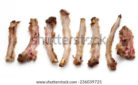Rib bones picked clean of meat on a white background