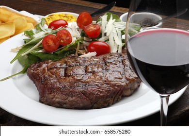 Rib Fillet With Salad And Red Wine